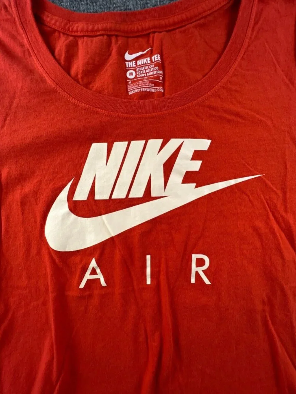The Nike Air Tee Short Sleeve Active Shirt Size Medium Athletic Cut Orange Logo